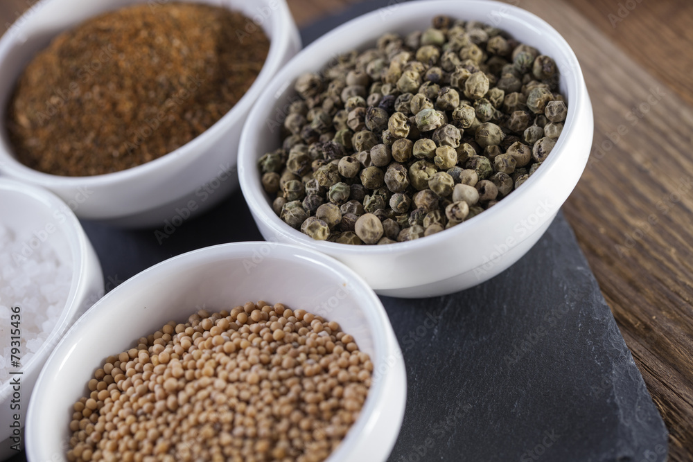 Aromatic spices in white bowls Aromatic spices in white bowls