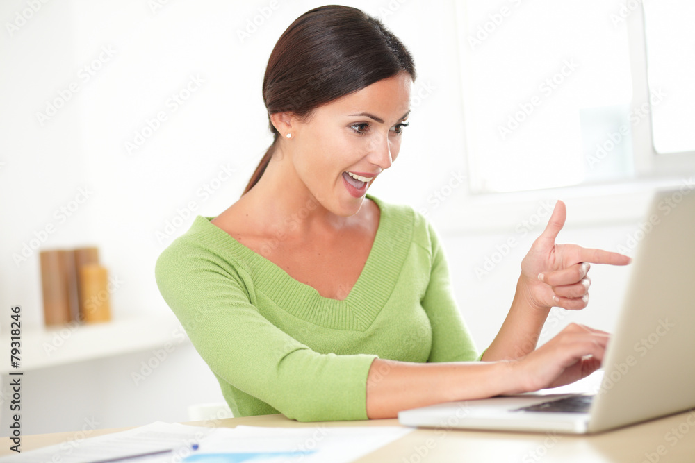 Elegant hispanic female surfing the web