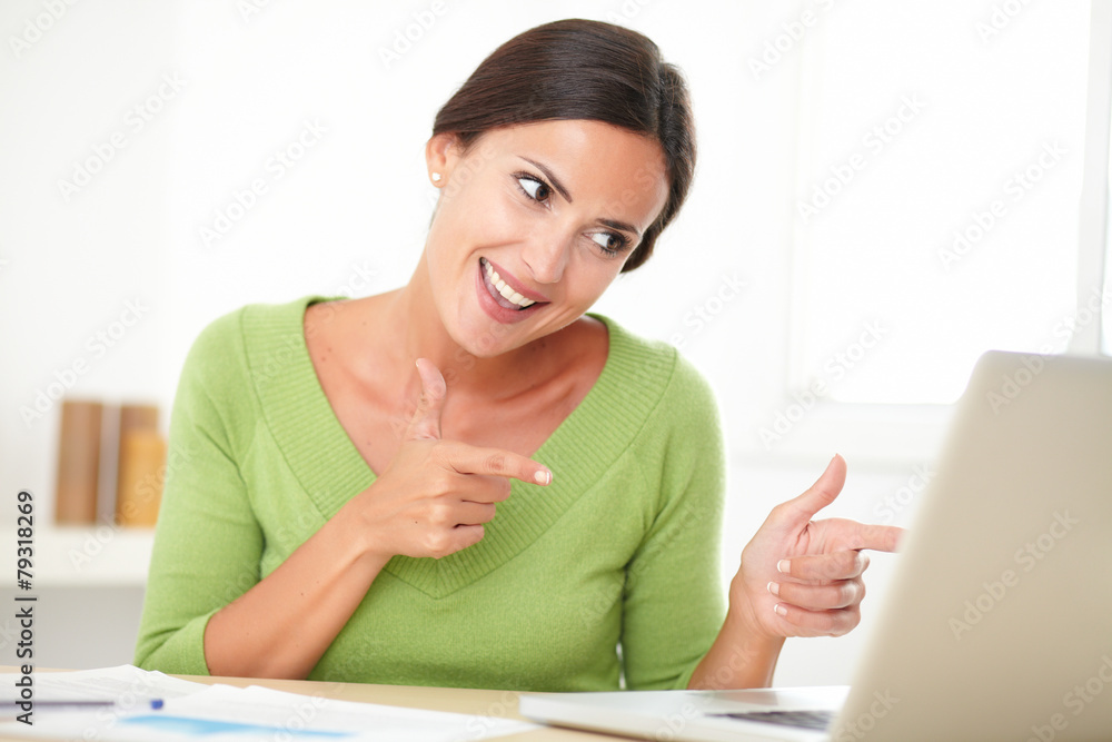 Elegant woman looking cheerfully while working Elegant woman looking cheerfully while working