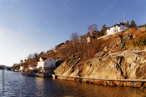 Wooden path on steep bank of fjord photo