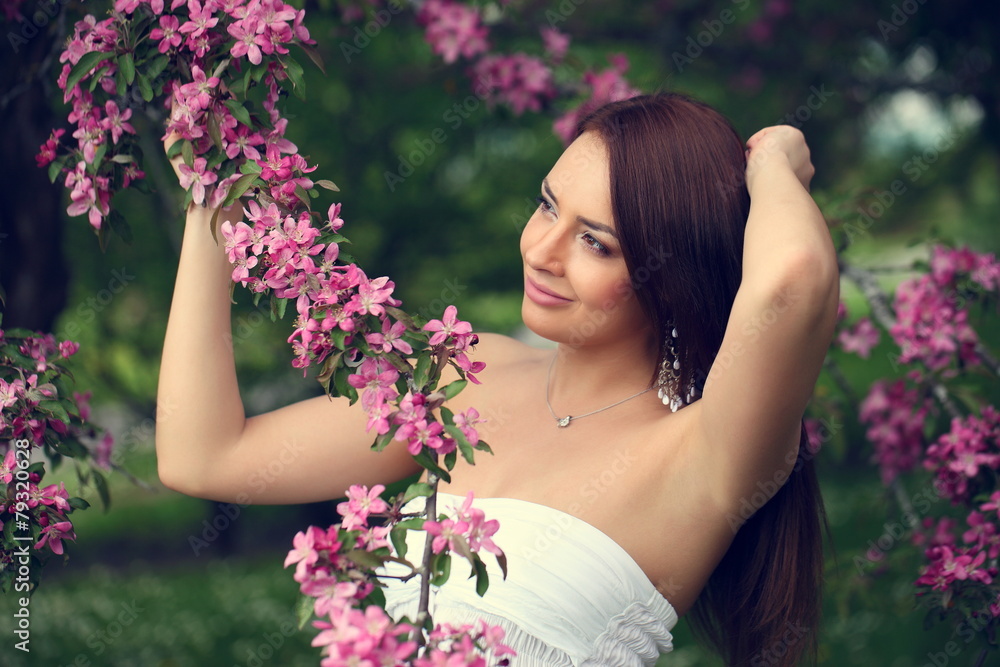 girl in flowers of apple tree girl in flowers of apple tree