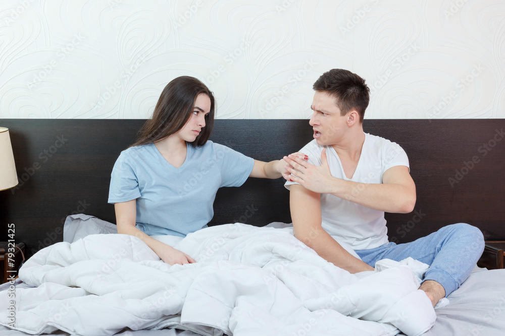 unhappy and annoyed young caucasian couple after quarreling in b unhappy and annoyed young caucasian couple after quarreling in b