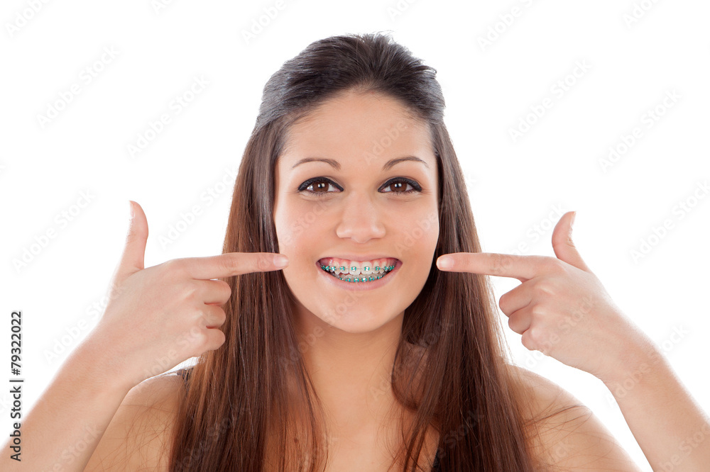 Attractive young woman pointing her brackets Attractive young woman pointing her brackets