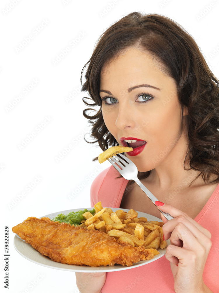 Young Woman Eating Fish and Chips with Mushy Peas Young Woman Eating Fish and Chips with Mushy Peas