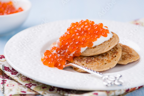 Photos Buckwheat blini with red caviar and sour cream