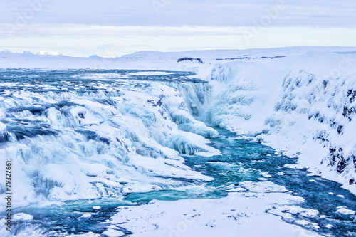 Beautiful winter waterfall background in Iceland