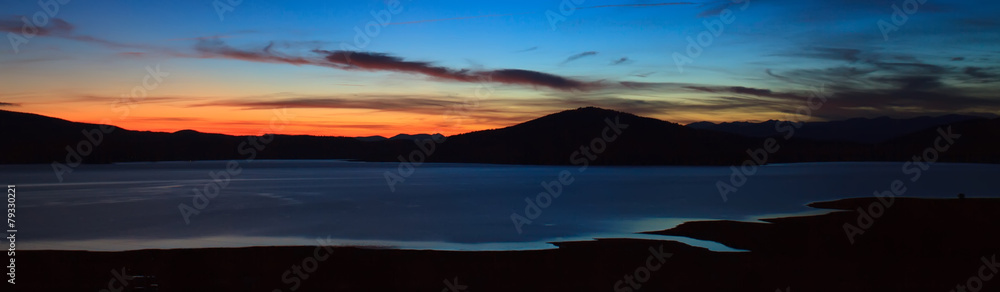 twilight panorama from high mountain lake, abstract nature background 