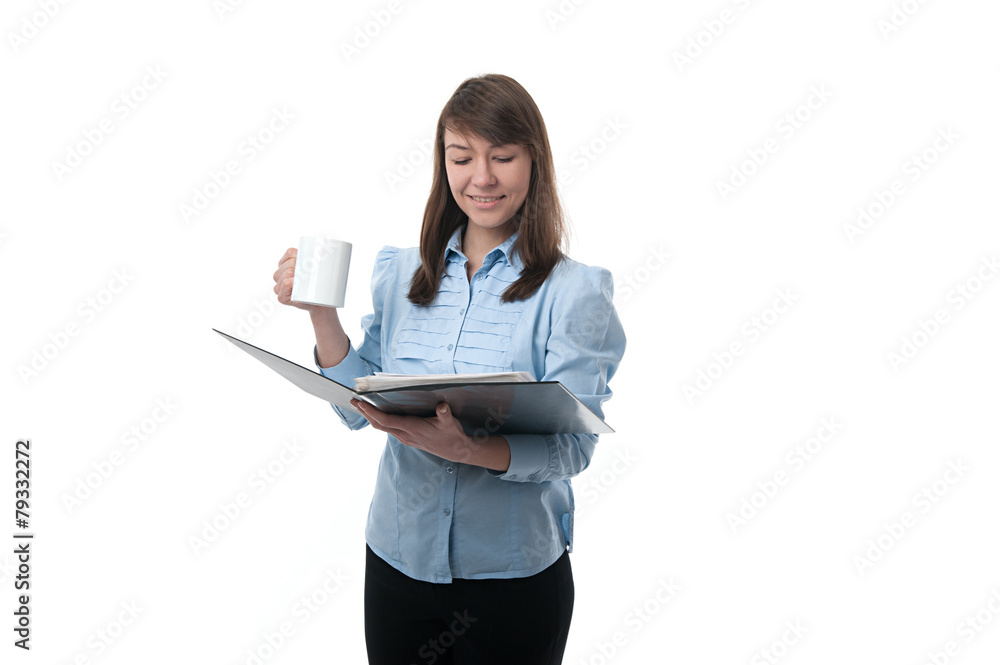 Young woman reading a paper and drinking coffee Young woman reading a paper and drinking coffee