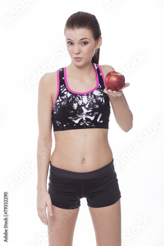 Healthy sporty girl with red apple
