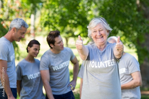 Happy volunteer grandmother with thumbs up