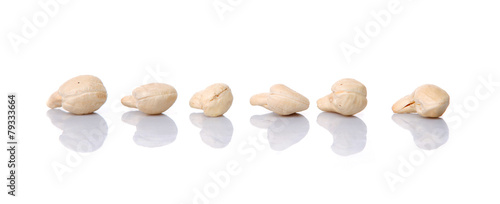 Raw cashew nuts over white background