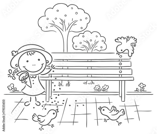 Girl feeding sparrows in the park