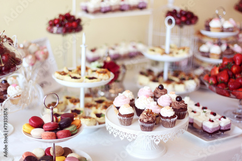 cupcakes,macaroons and sweets in a candy bar photo