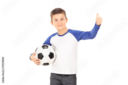 Boy holding a football and giving a thumb up © Ljupco Smokovski