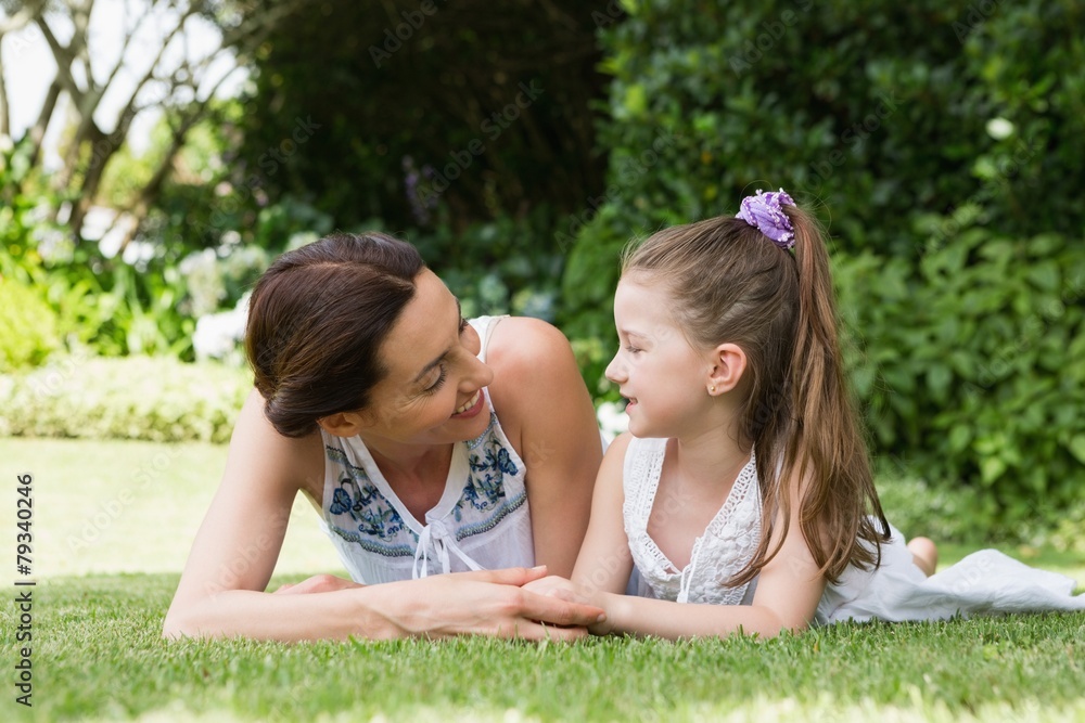 Mother and daughter smiling at each other Mother and daughter smiling at each other