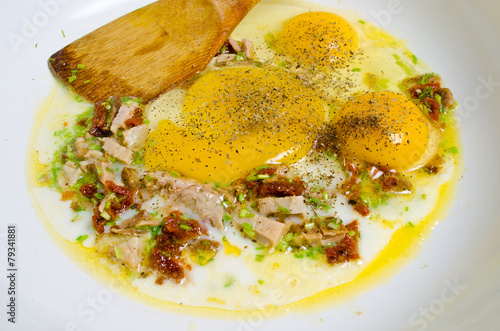Naklejka Scrambled eggs with ham and chive