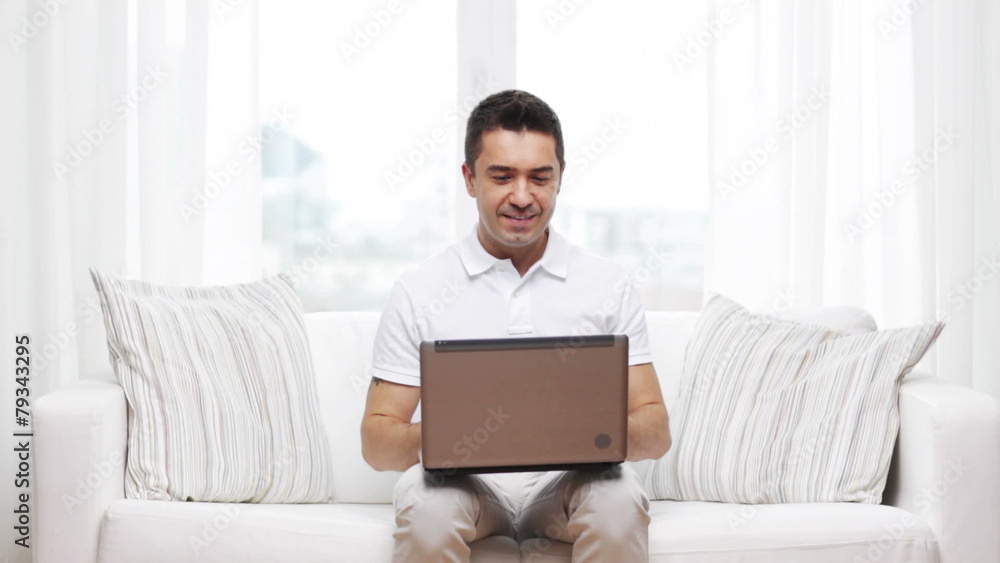 happy man working with laptop computer at home happy man working with laptop computer at home