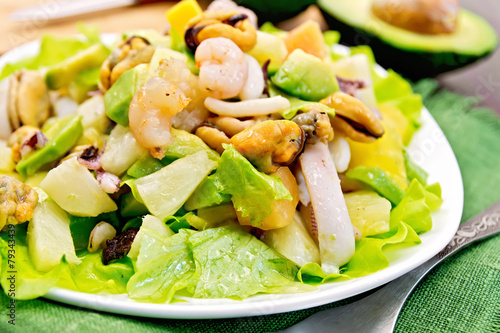 Salad seafood and avocado on green napkin