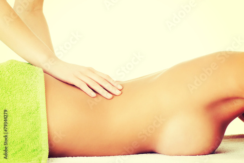 Beautiful woman lying on a massage table.