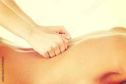 Beautiful woman lying on a massage table.