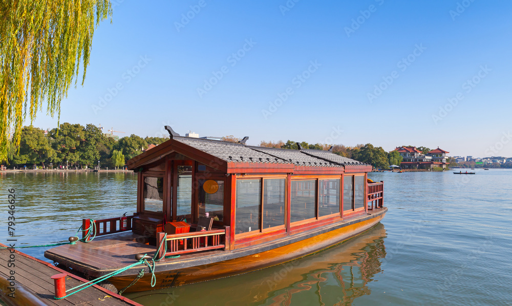 Traditional Chinese red wooden water taxi boat