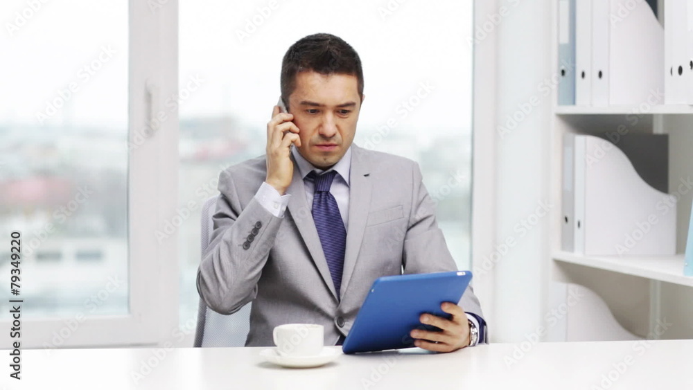 businessman with tablet pc calling on smartphone businessman with tablet pc calling on smartphone