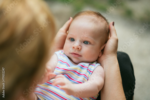 Baby looking at his mother