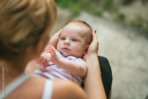 Fotografi Loving mother with baby in her lap