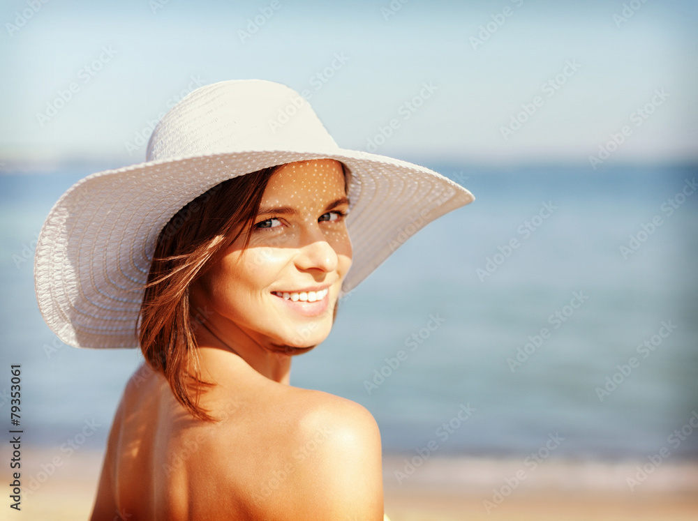 girl in bikini standing on the beach