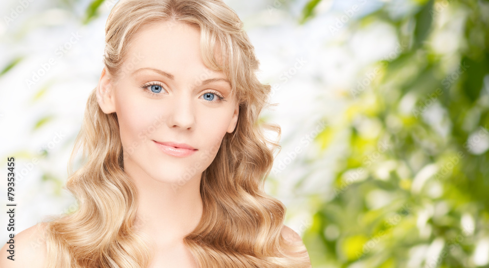 Fototapeta premium beautiful young woman face with long wavy hair