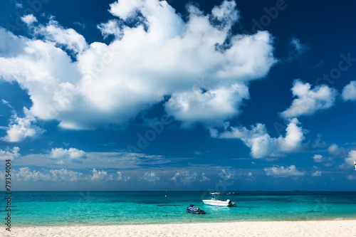 Beautiful island beach with motor boat