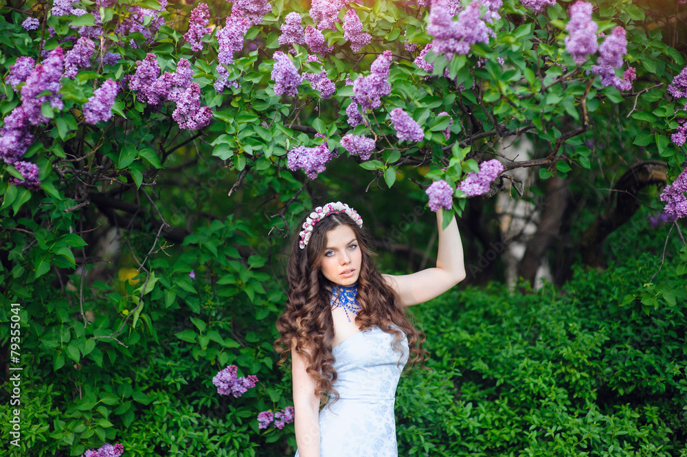 beautiful young brunette woman in the park flowers lilac beautiful young brunette woman in the park flowers lilac