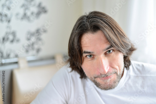 Portrait of man sitting in living room