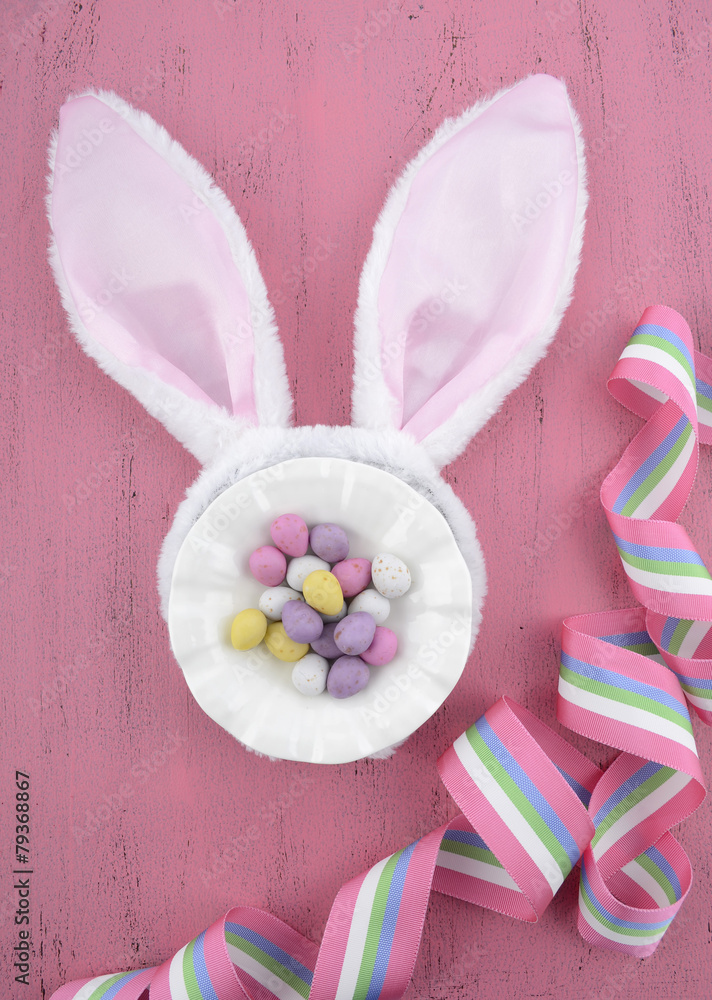 Easter bunny ears on pink wood background. Easter bunny ears on pink wood background.