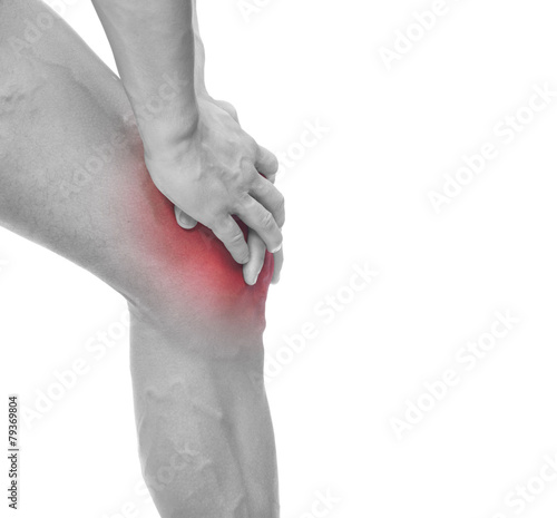 Man holding his painful knee, isolated on white background © cristovao31
