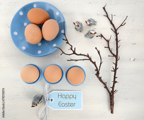 Easter blue and white table with fresh eggs photo