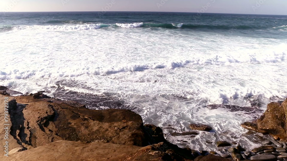 Ocean waves crash against the rocks Ocean waves crash against the rocks