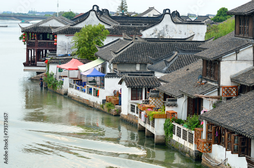 Old village by river in Shanghai with boat..