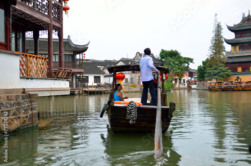 Photography Old village by river in Shanghai with boat..