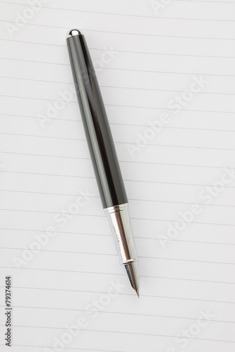 Fountain pen in a notebook © daizuoxin
