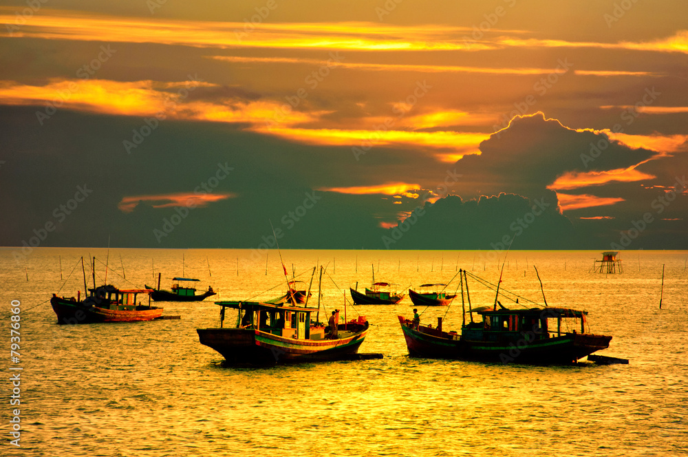 Boats in fishing village in sunset, Vietnam