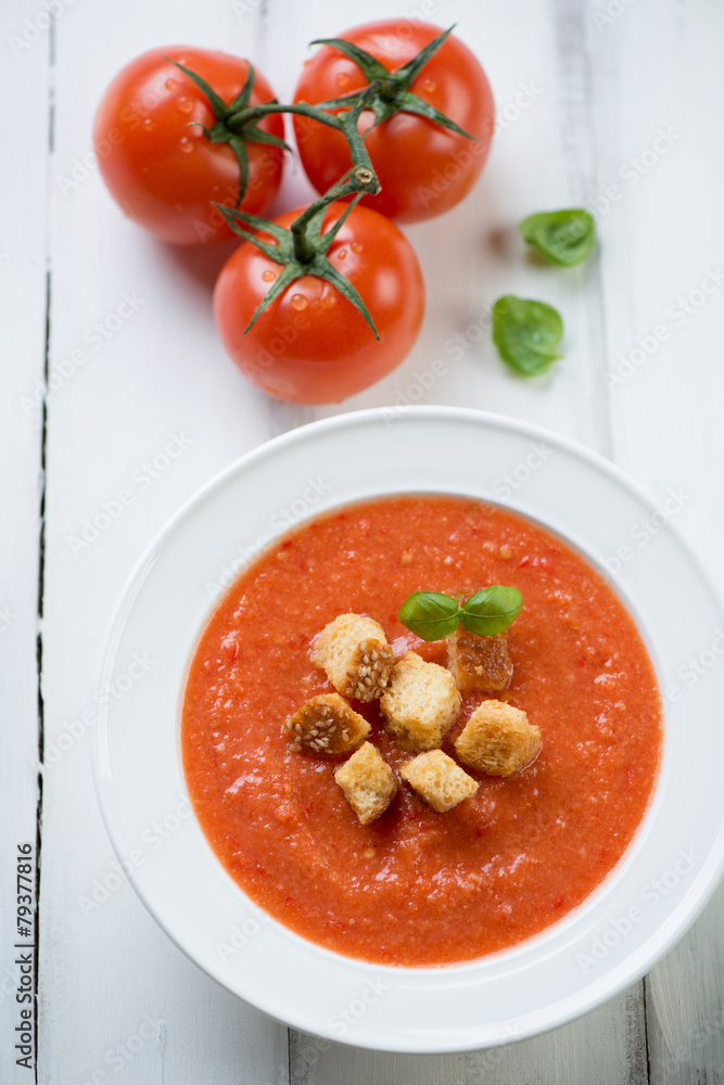 Tomato soup Gazpacho over white wooden background, above view Tomato soup Gazpacho over white wooden background, above view