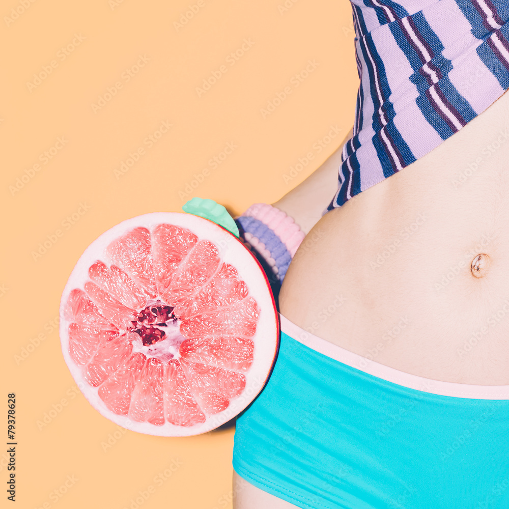 Summer girl with grapefruit. Tropical style, fashionable clothes - obrazy, fototapety, plakaty 