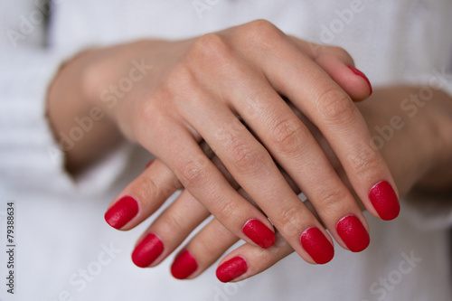 Female hands with red nails