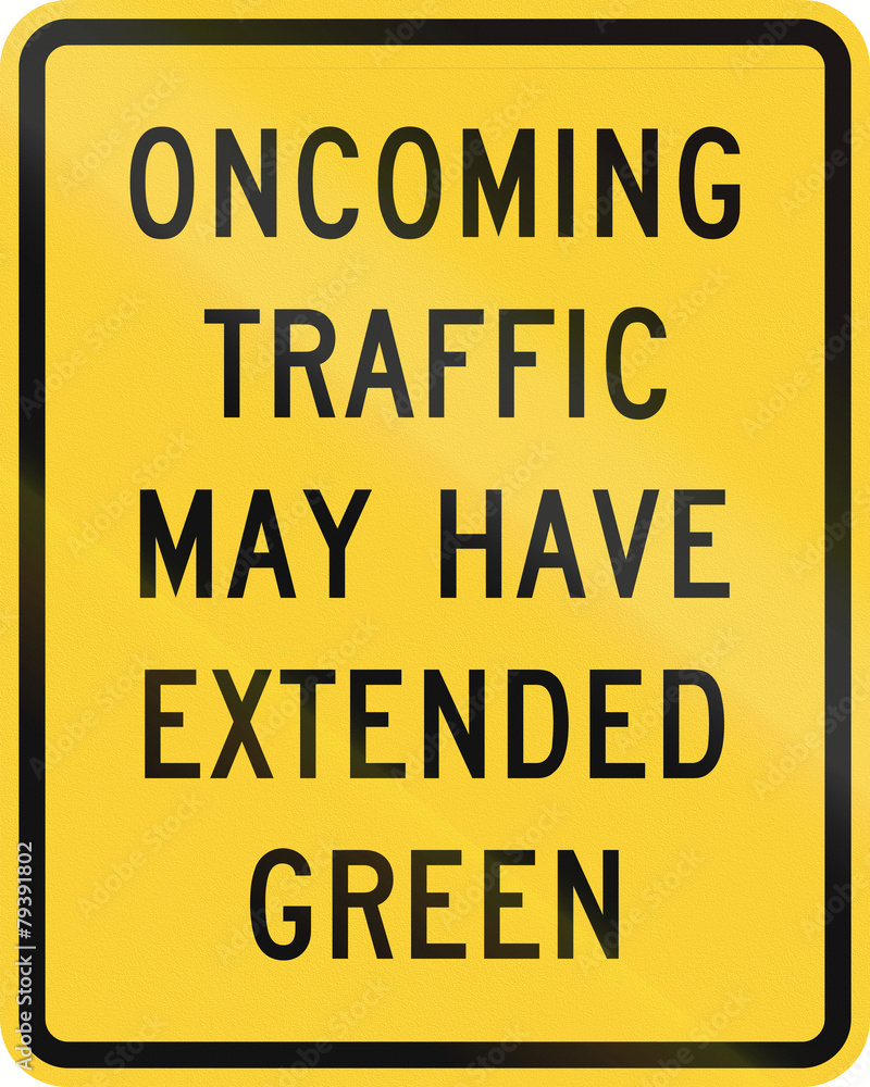 US road warning sign: Oncoming traffic may have extended green US road warning sign: Oncoming traffic may have extended green