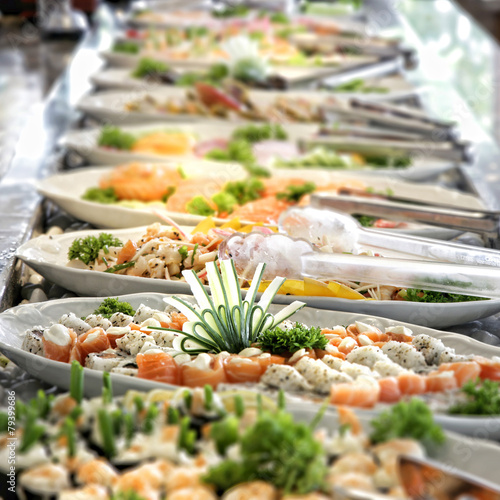 Bild auf Leinwand A shallow depth of field image looking along a sushi buffet bar
