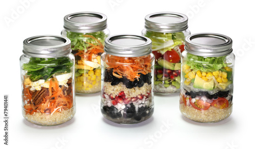 vegetable salad in glass jar on white background