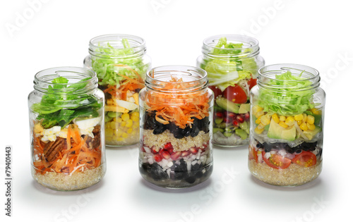 vegetable salad in glass jar on white background, no lid