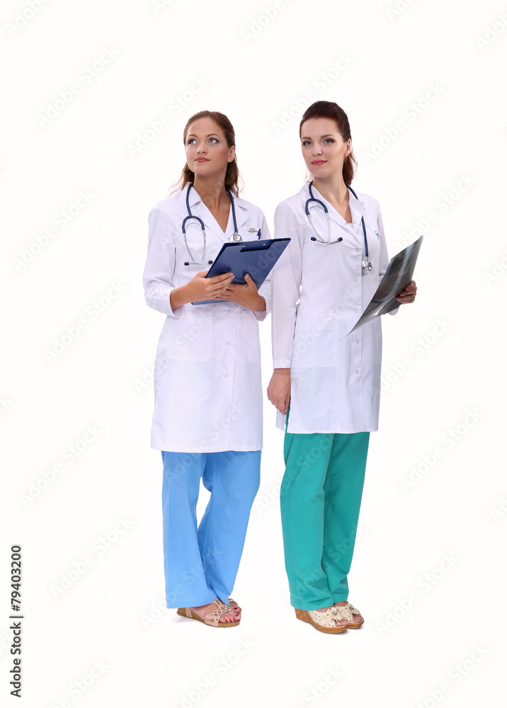 Two woman nurse watching X Ray image, standing in hospital Two woman nurse watching X Ray image, standing in hospital