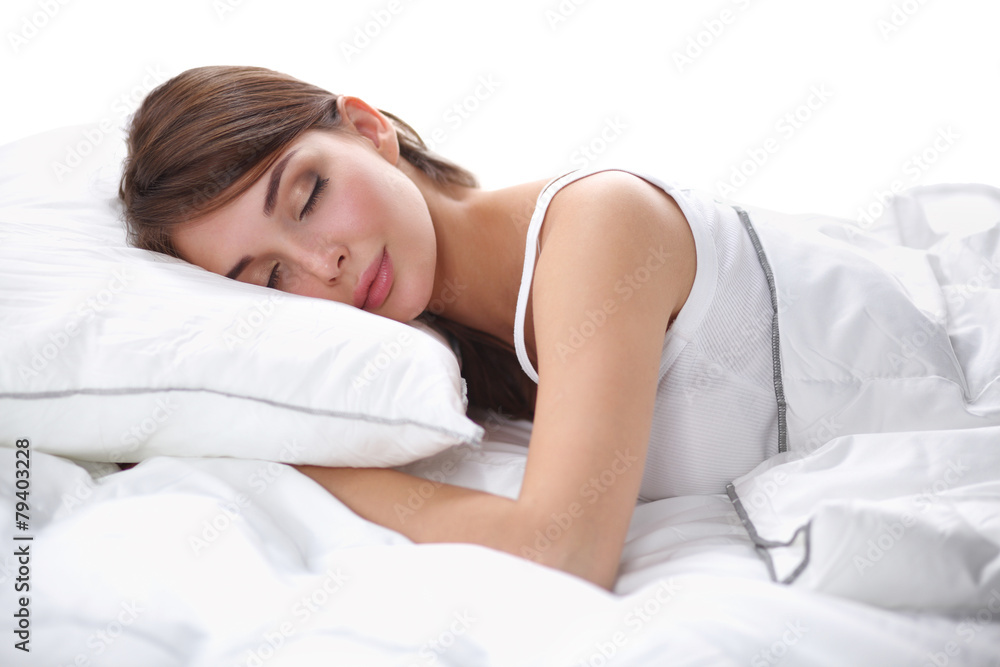 Beautiful girl sleeps in the bedroom, lying on bed Beautiful girl sleeps in the bedroom, lying on bed